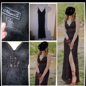 A beautiful black dress with a slit at the thigh.It has a Corset in the middle.